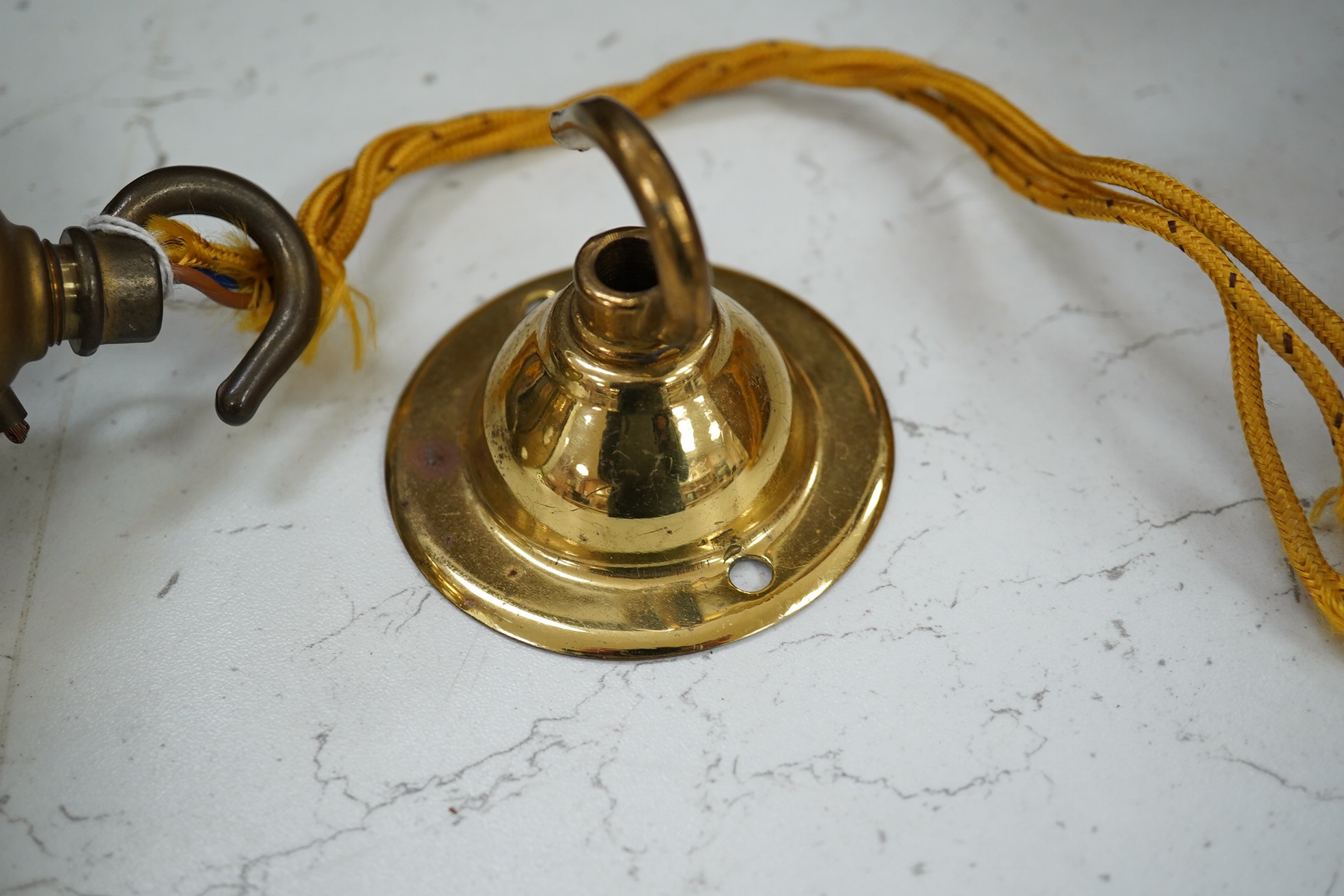 An Art Nouveau frosted and green glass pendant light, with brass attachment and hook, 25cm high. Condition - good